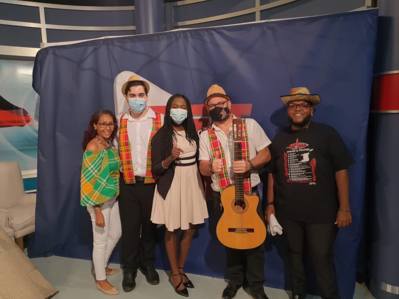 Choir members in Madras attire during a television appearance